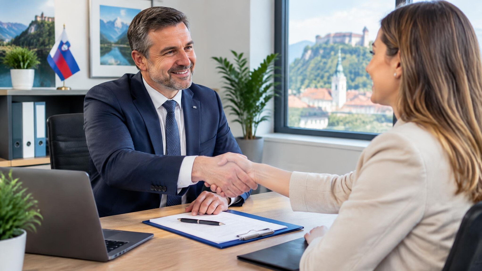 Advisor and client shaking hands after signing documents